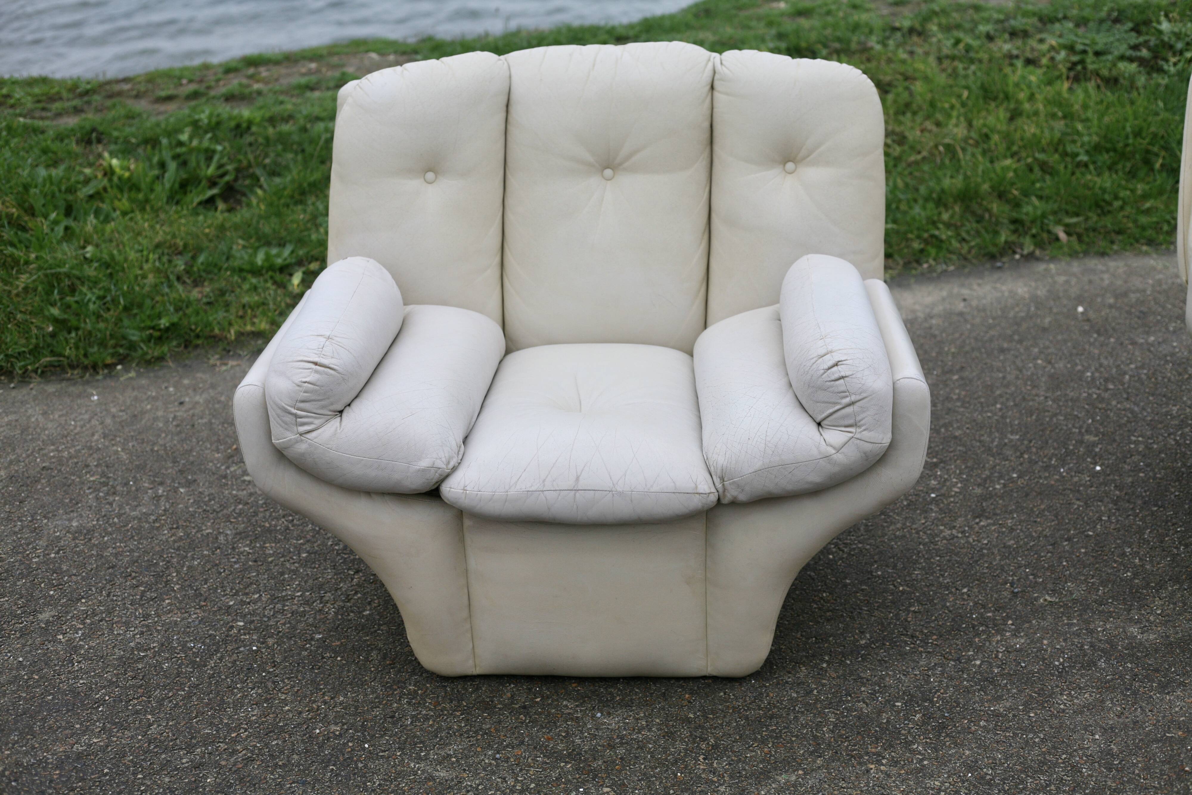 Pair of leather “space age” armchairs. Cream colour". Circa 1970.