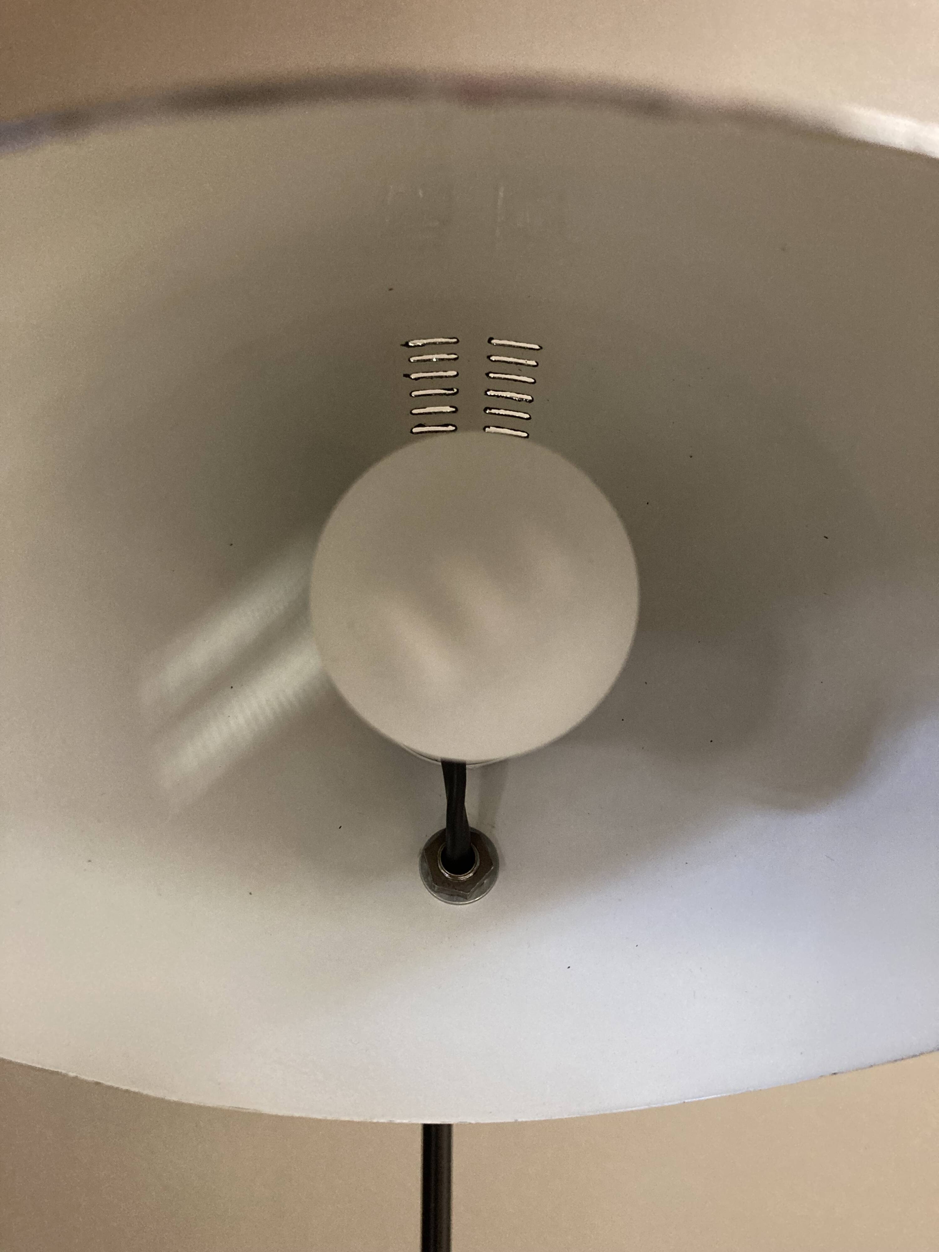 Black metal tripod floor lamp