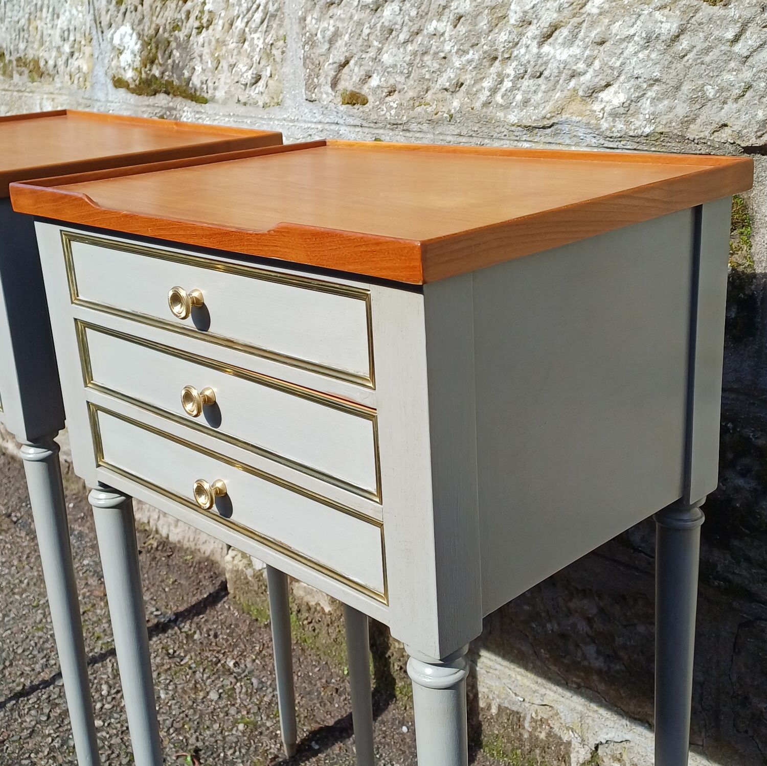 Pair of patinated bedside tables in Louis XVI style