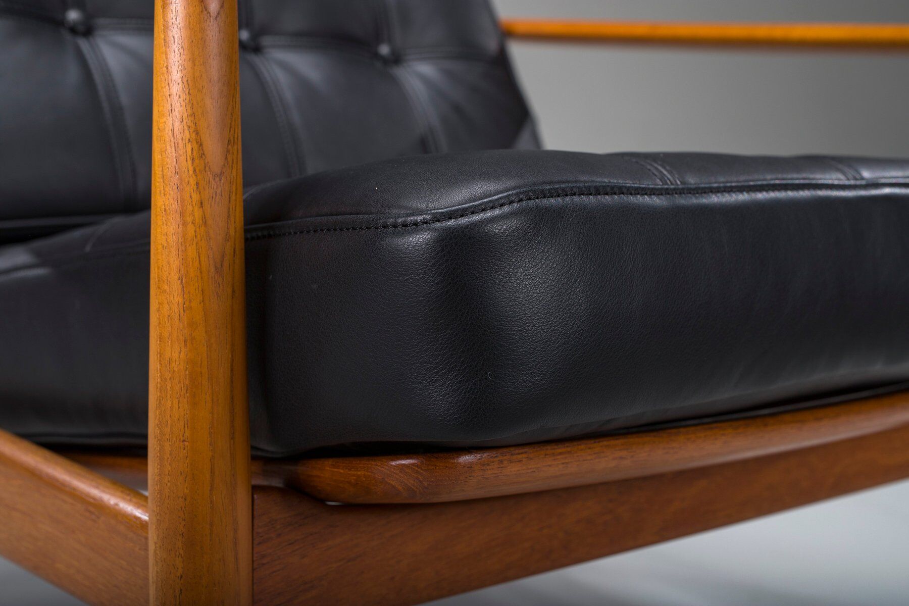 Armchair with Model FD 164 frame by Arne Vodder and Model 118 armrests by Grete Jalk in teak and black leather, Denmark, 1960s