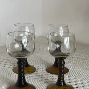Footed glasses of the Roemer type, amber colour