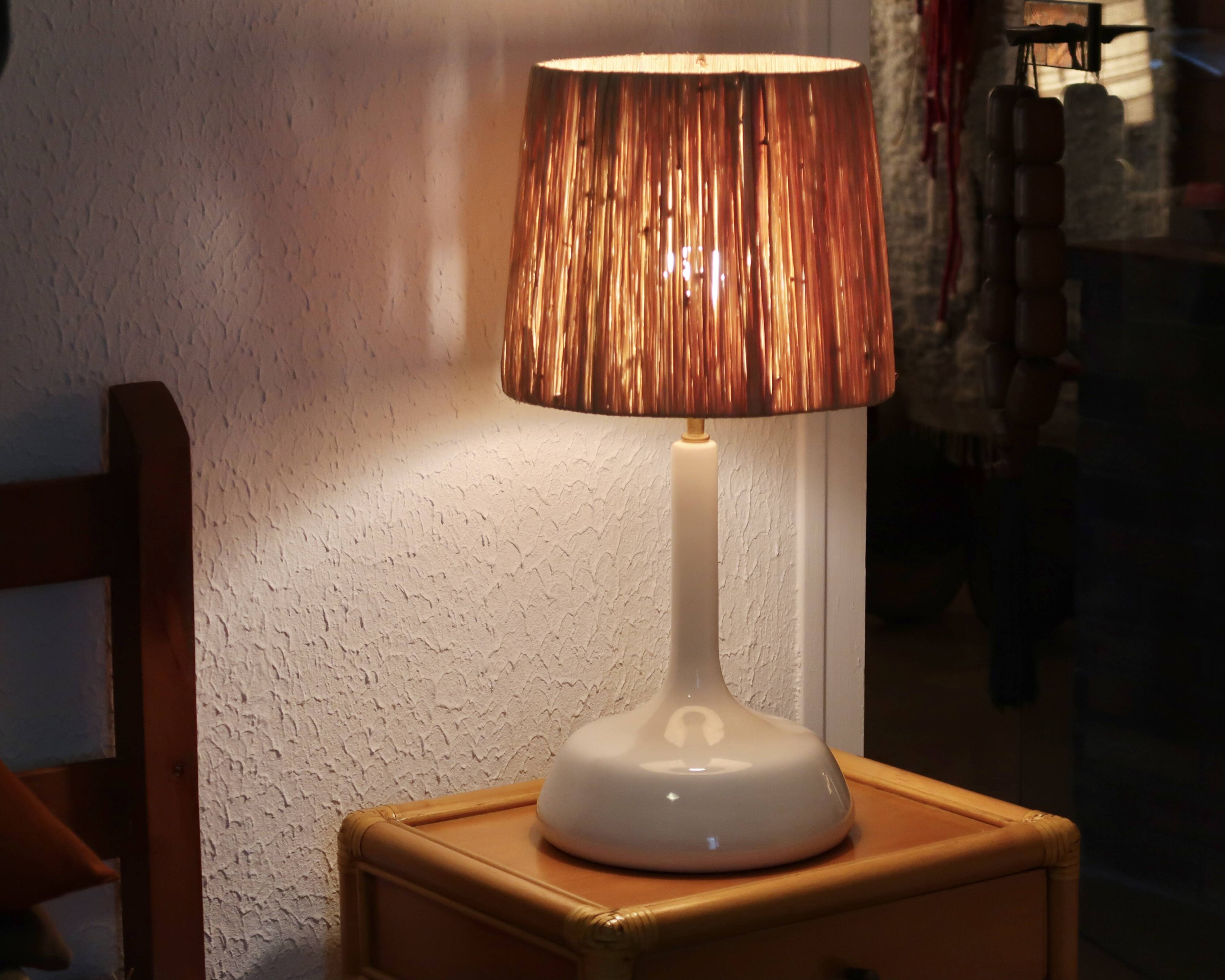 Large white ceramic lamp with raffia shade, 1970s