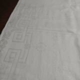 Table napkins set of eleven in a single piece damask linen and silk early 20th century.