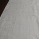 Table napkins set of eleven in a single piece damask linen and silk early 20th century.