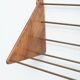 Wall-mounted walnut bookshelf by Carl Auböck, 1950s