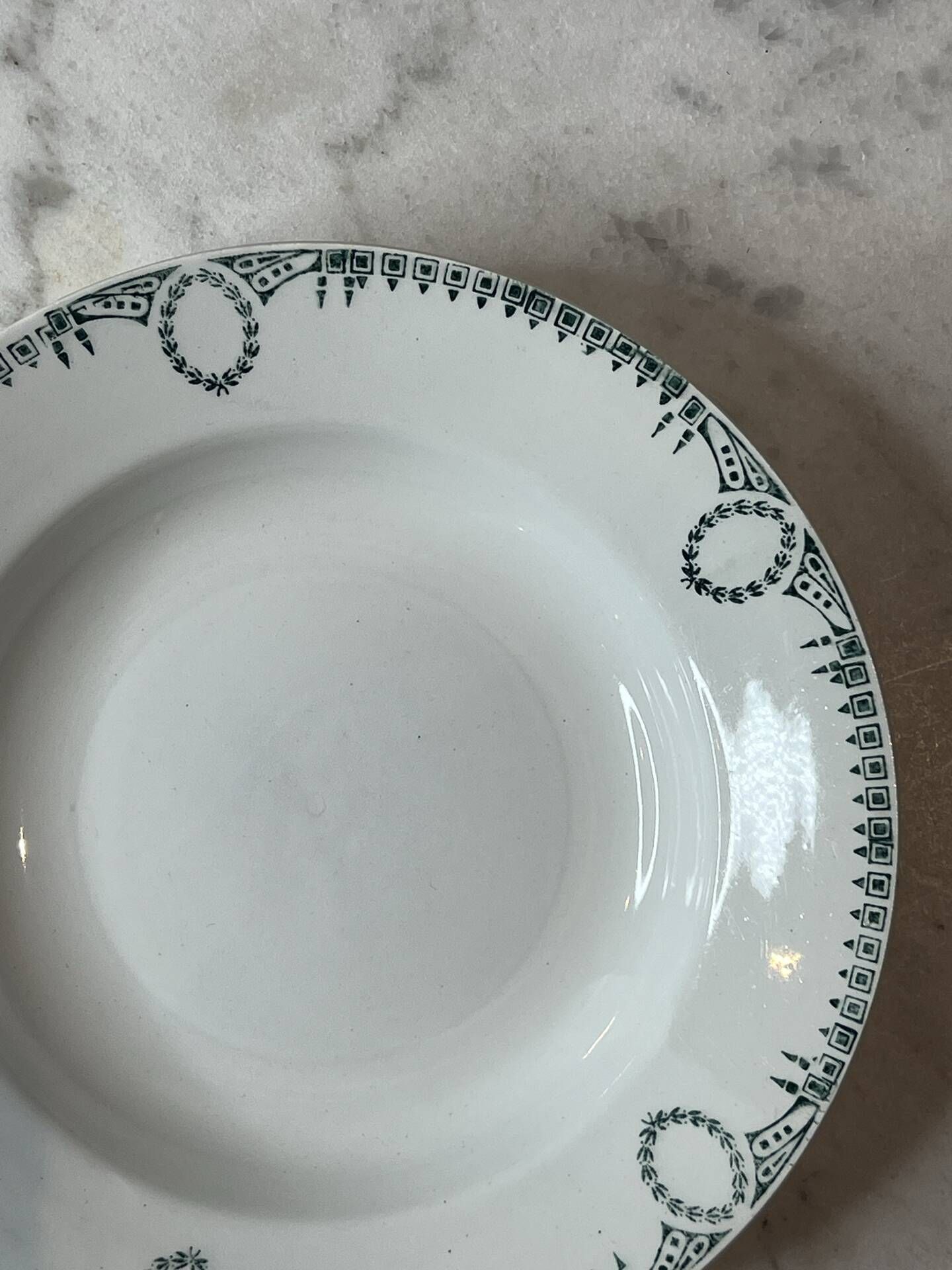 Set of 4 deep plates from Saint Amand with laurel wreath decoration.