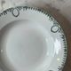 Set of 4 deep plates from Saint Amand with laurel wreath decoration.