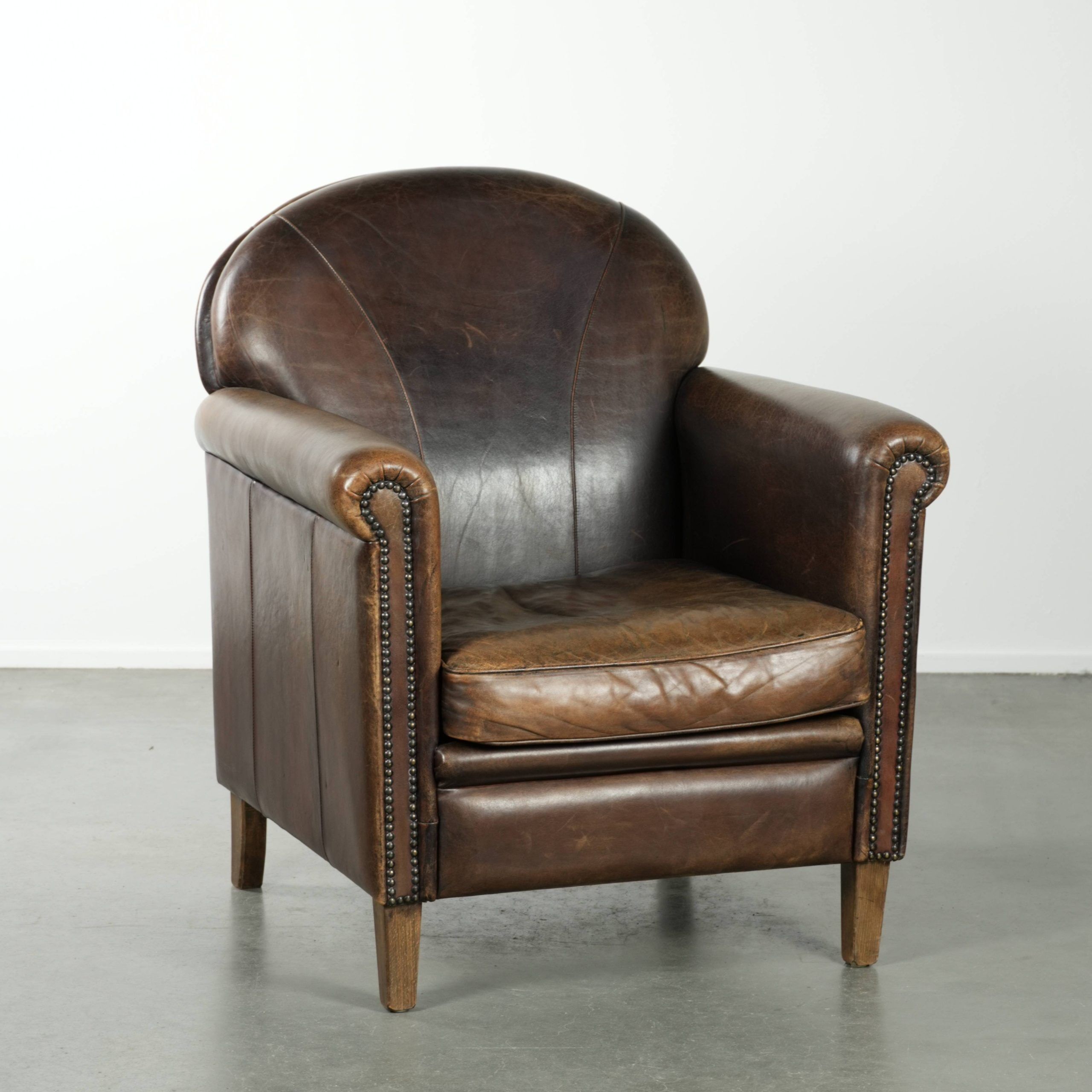 Characterful sheepskin design armchair with beautiful patina