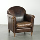 Characterful sheepskin design armchair with beautiful patina