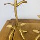 Pair of golden foliage candlesticks