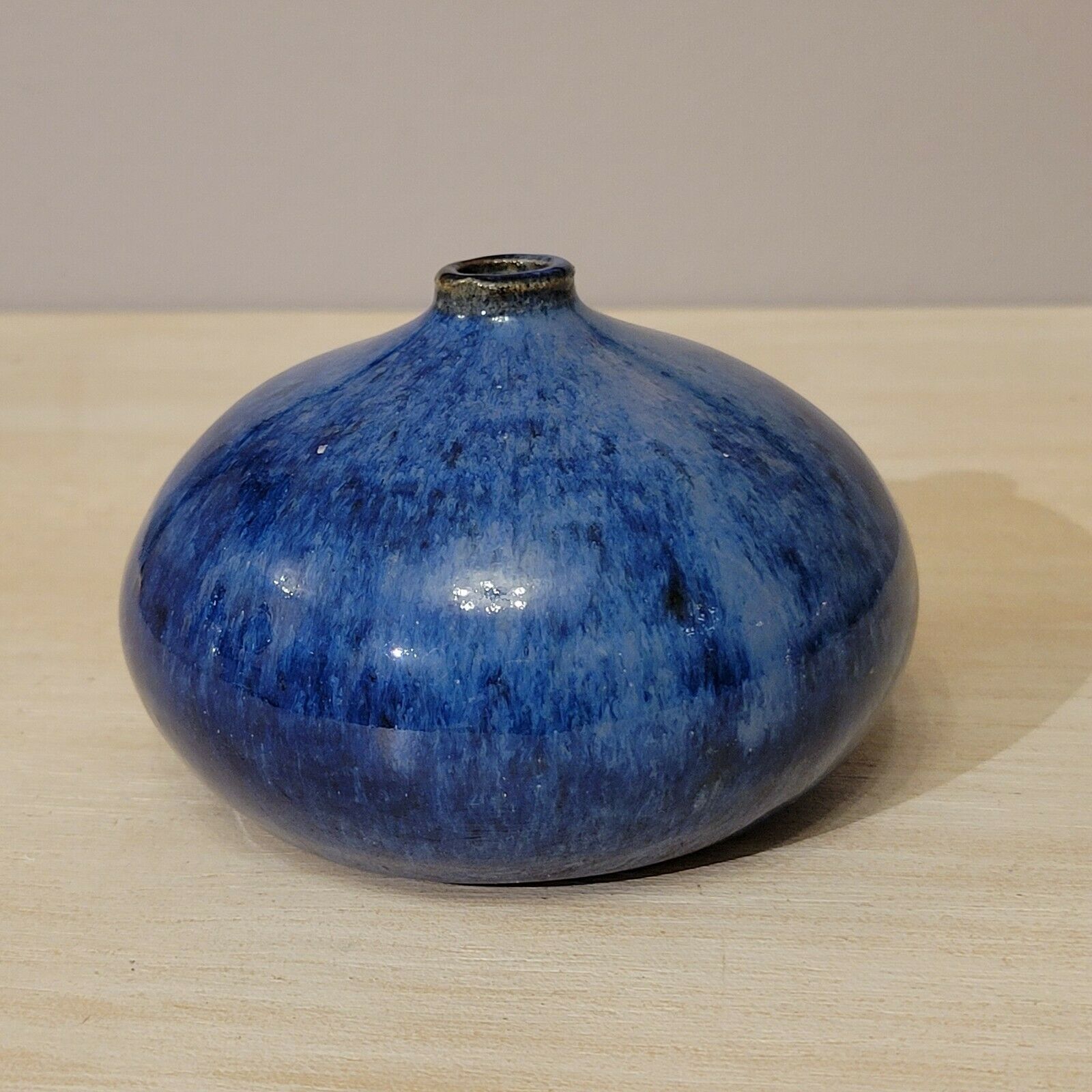 Small blue enamelled ceramic ball vase