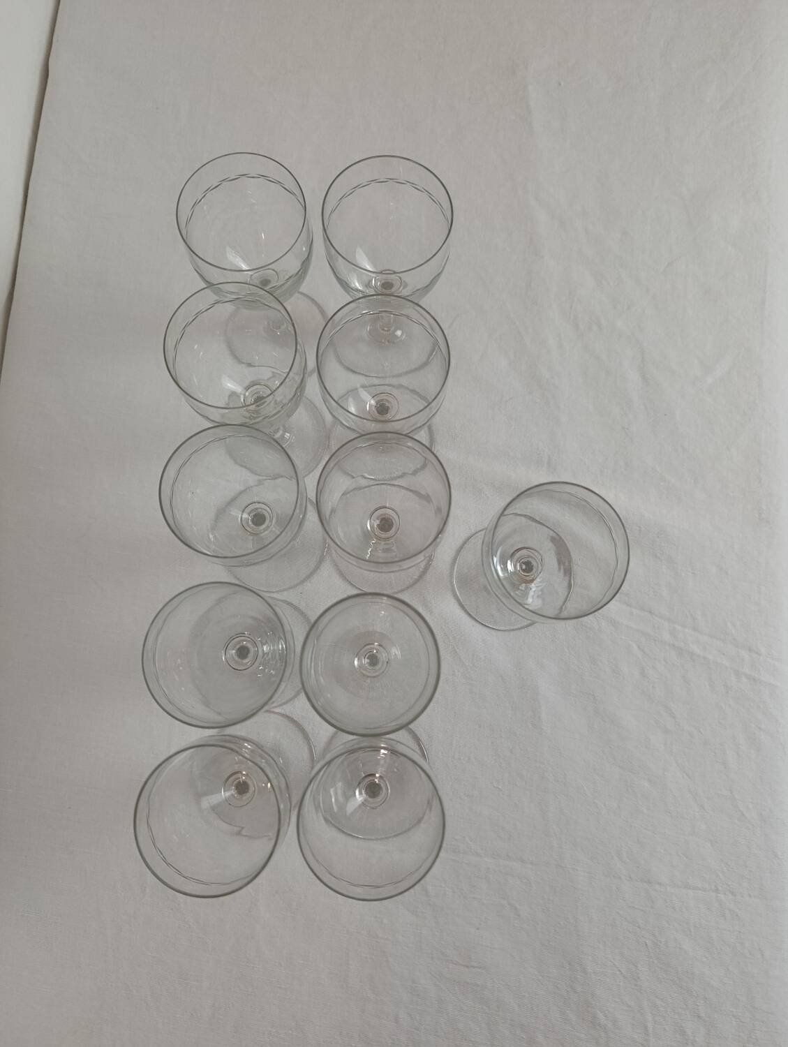 Set of 11 antique engraved crystal liqueur glasses.