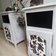 Two solid wood bedside tables with calfskin decoration.