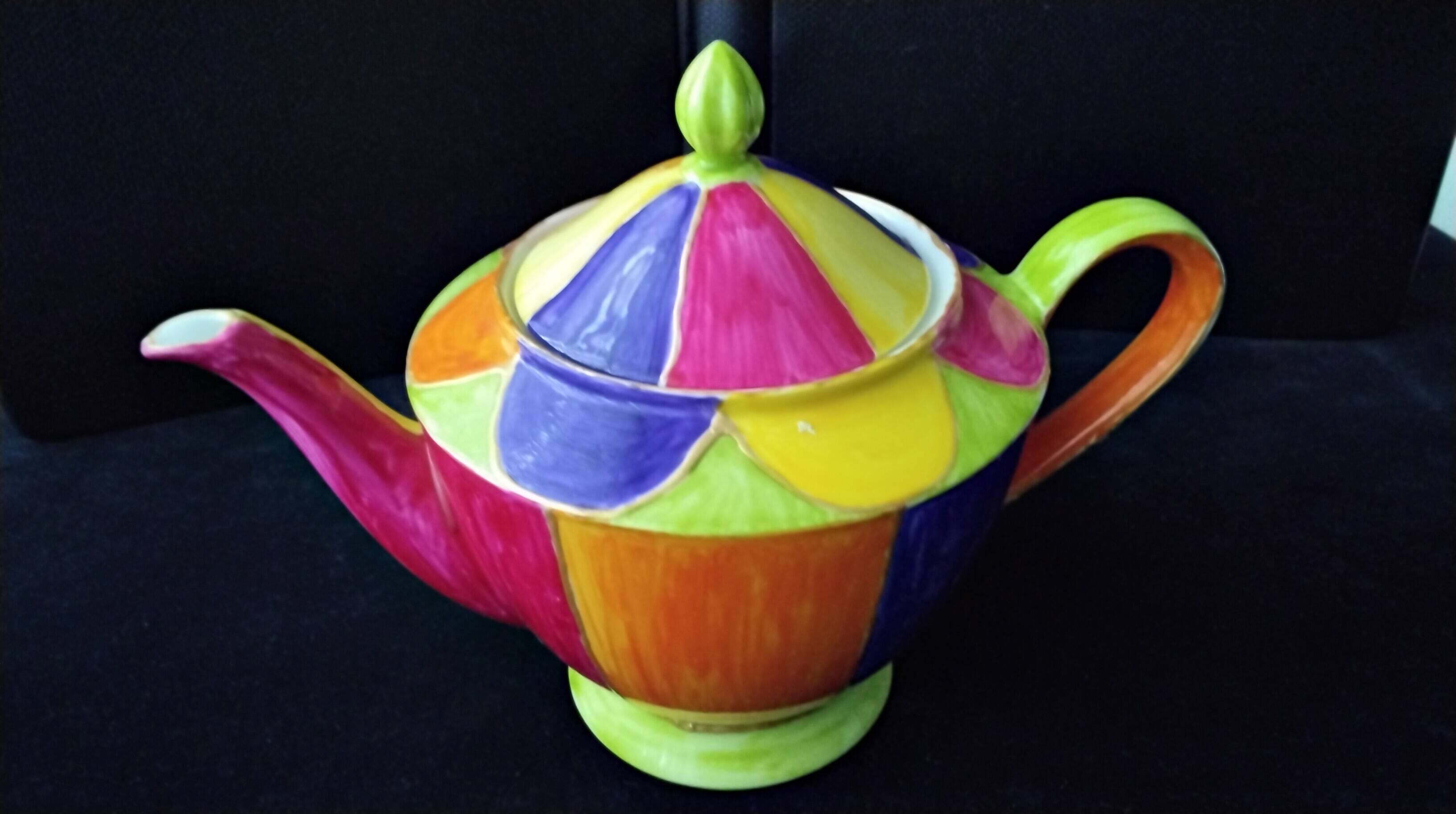 Polychrome porcelain teapot hand-painted.