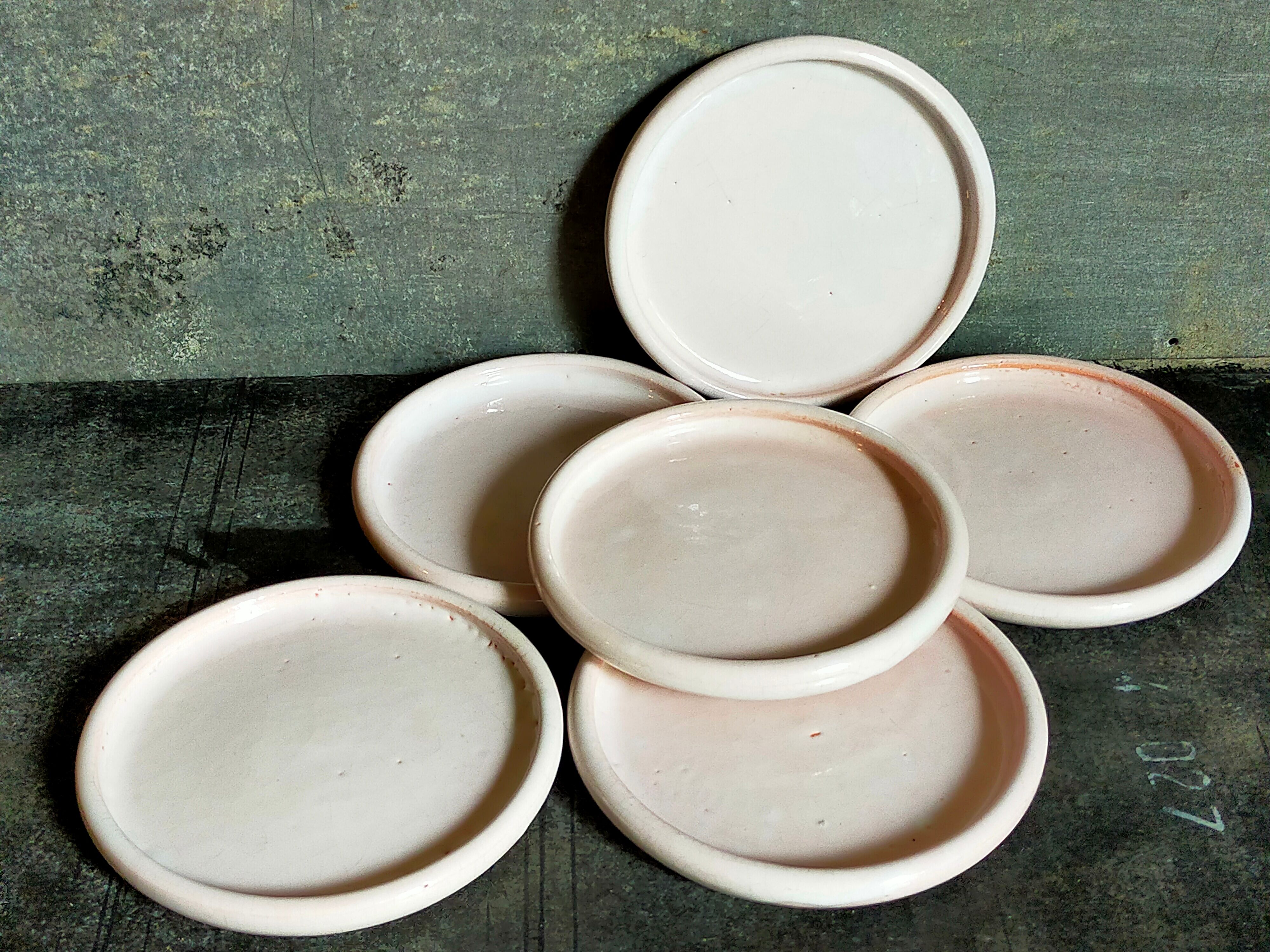 Six antique enamelled earth cut-cups