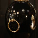 Black lamp in Hollywood Regency style