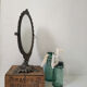 Old mirror on foot metal 30x46cm