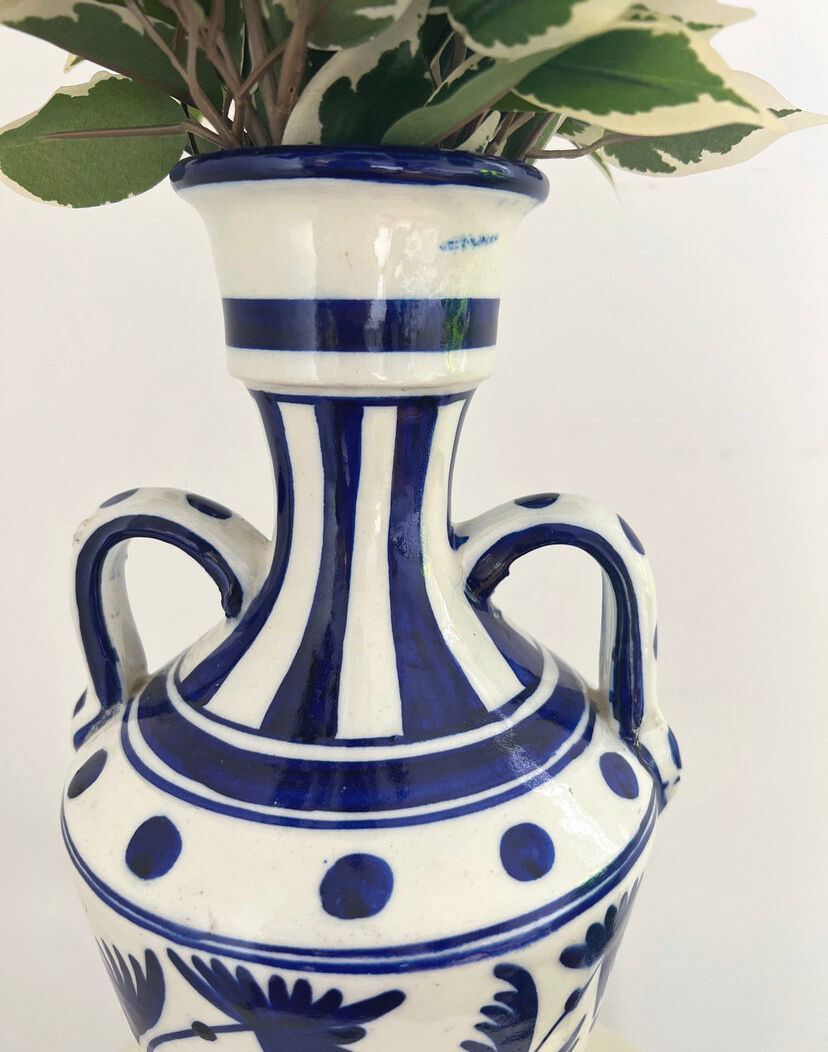 white amphora-style vase with hand-painted blue patterns