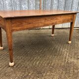 Antique solid cherry farmhouse table with 2 end drawers and 1 pull-out.