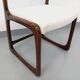 Vintage sled chair by Baumann in wood and boucle fabric.