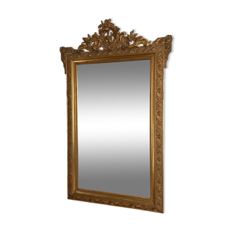 Late 19th century gilded mirror 140x88. Decorated pediment.