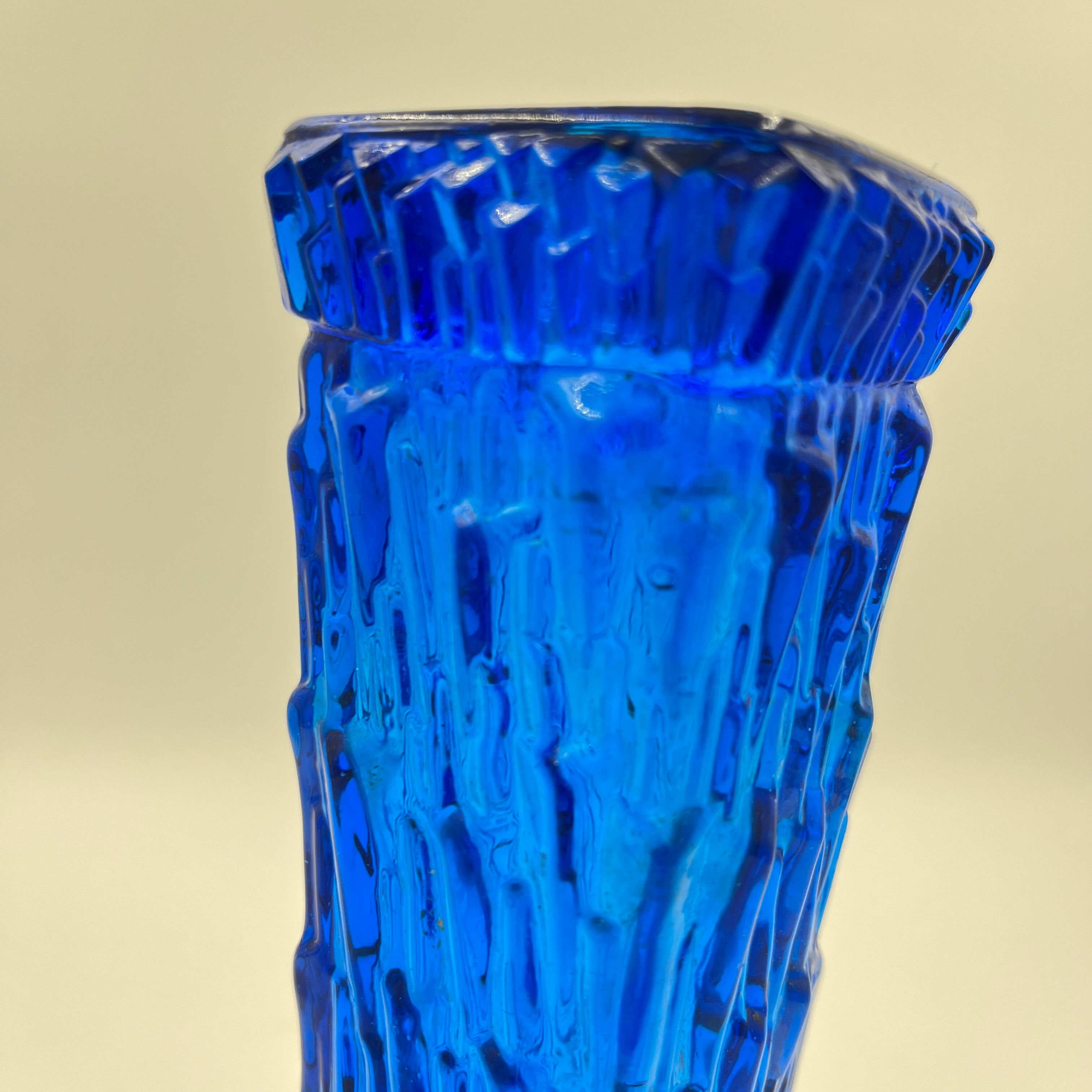 Blue glass vase with relief