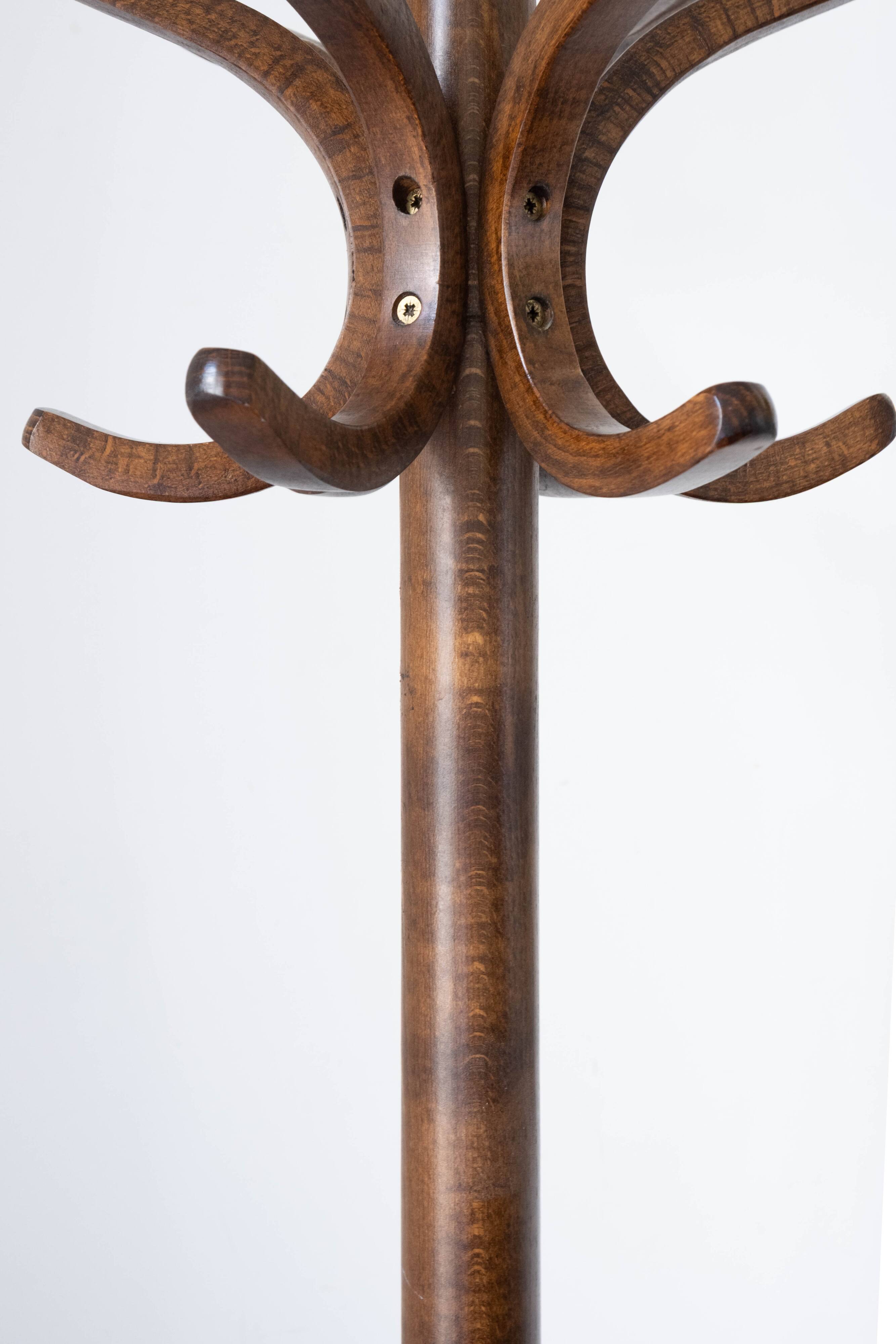 Baumann swivel parrot coat rack, dark wood.