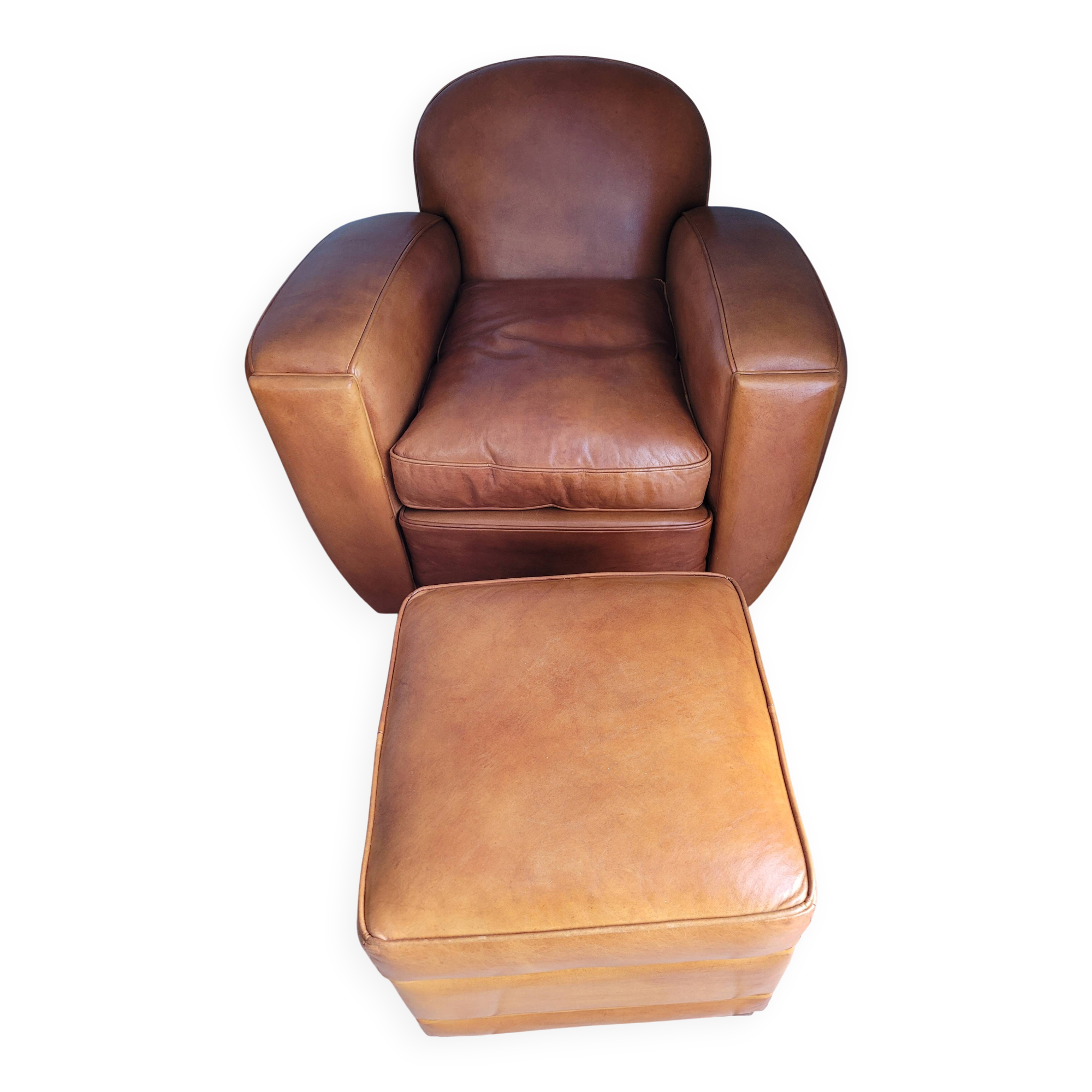 Leather club armchair and its pouf