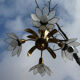 Brass chandelier and flowers in mother-of-pearl petals