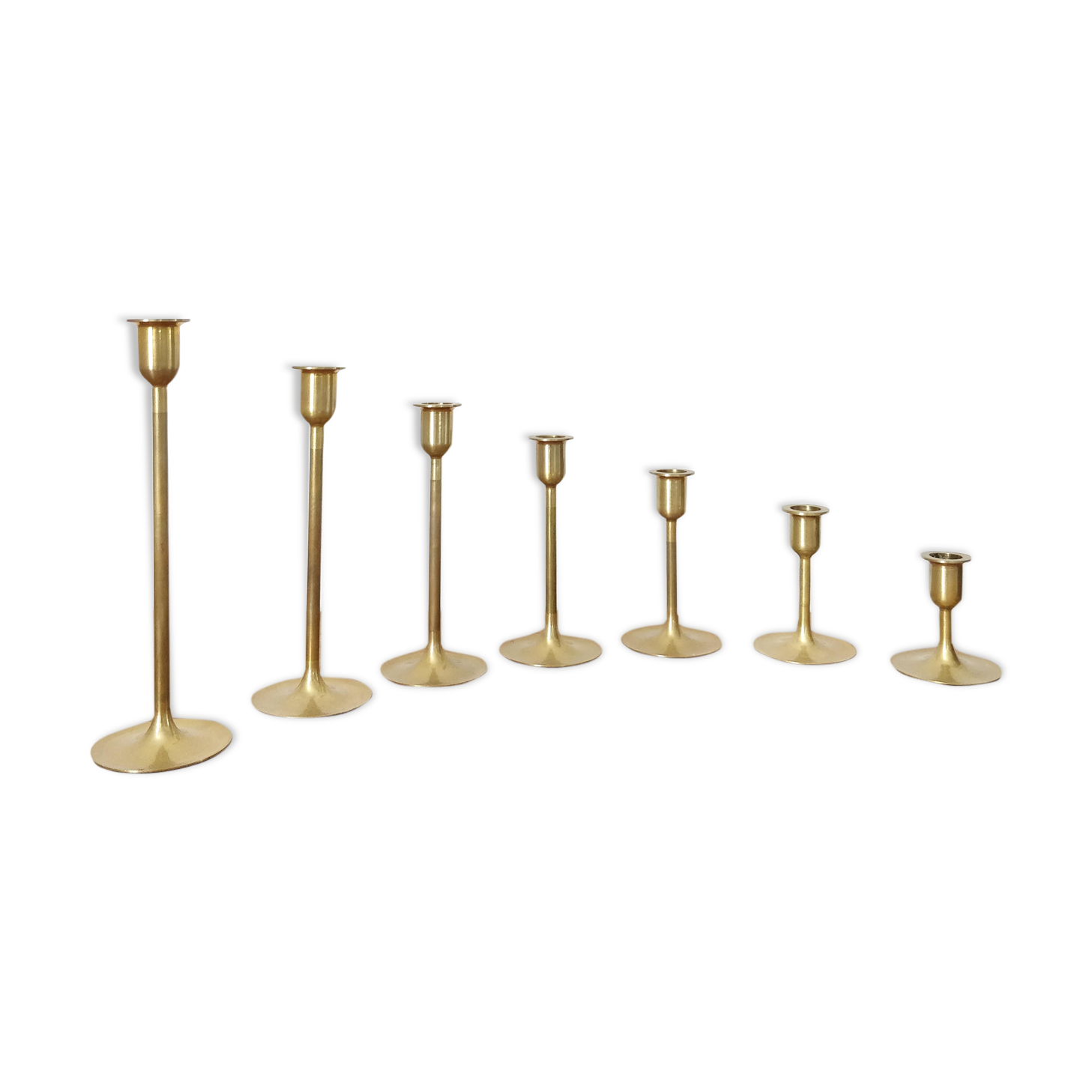 Set of 7 brass candlesticks