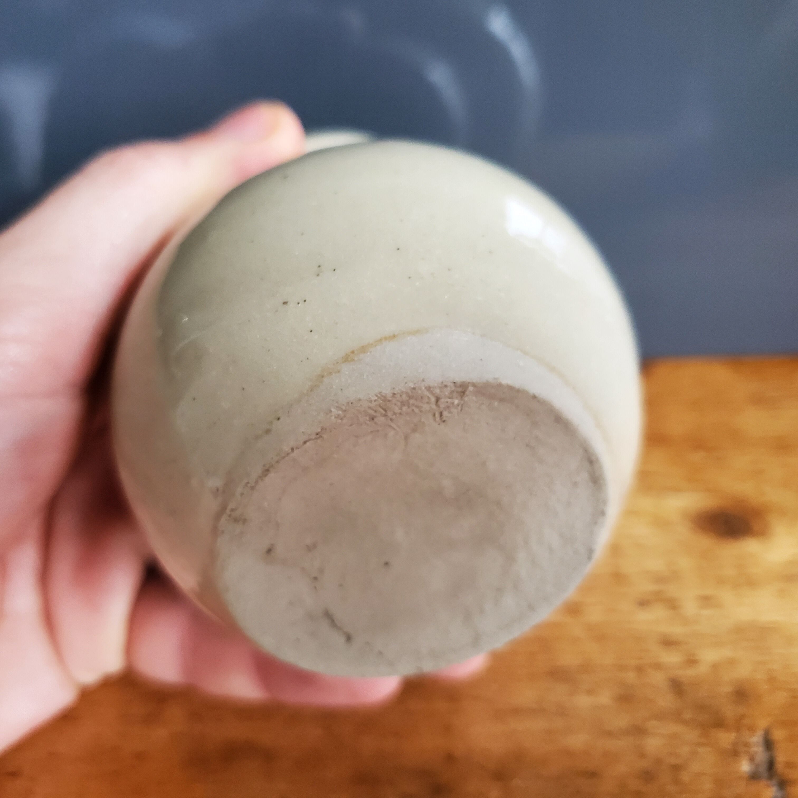 Small beige ball vase in glazed sandstone