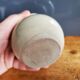 Small beige ball vase in glazed sandstone