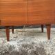 Vintage secretary with wooden compass feet with felling, shop window and closet