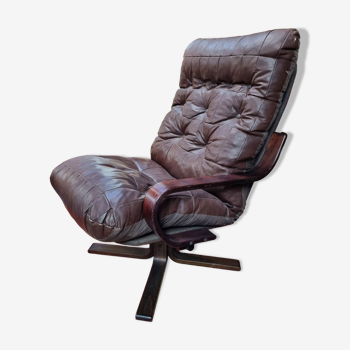 Scandinavian tilting and rotating armchair