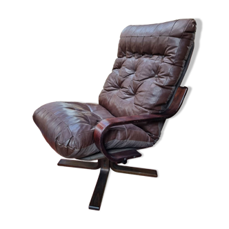 Scandinavian tilting and rotating armchair