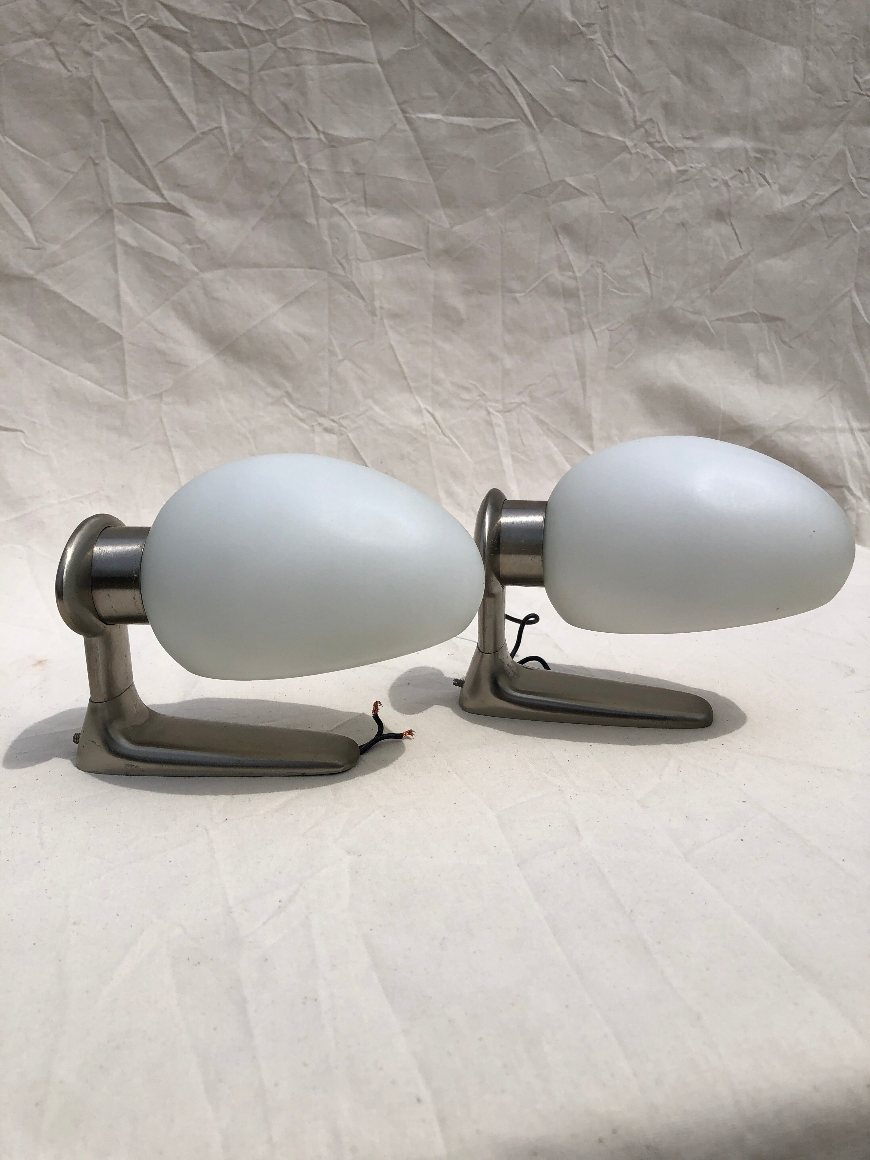 Pair of brushed steel appliques, half-egg opaline, 1970