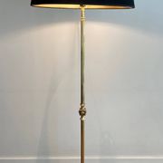 Neoclassical brass floor lamp with claw feet from Maison Jansen.