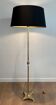 Neoclassical brass floor lamp with claw feet from Maison Jansen.