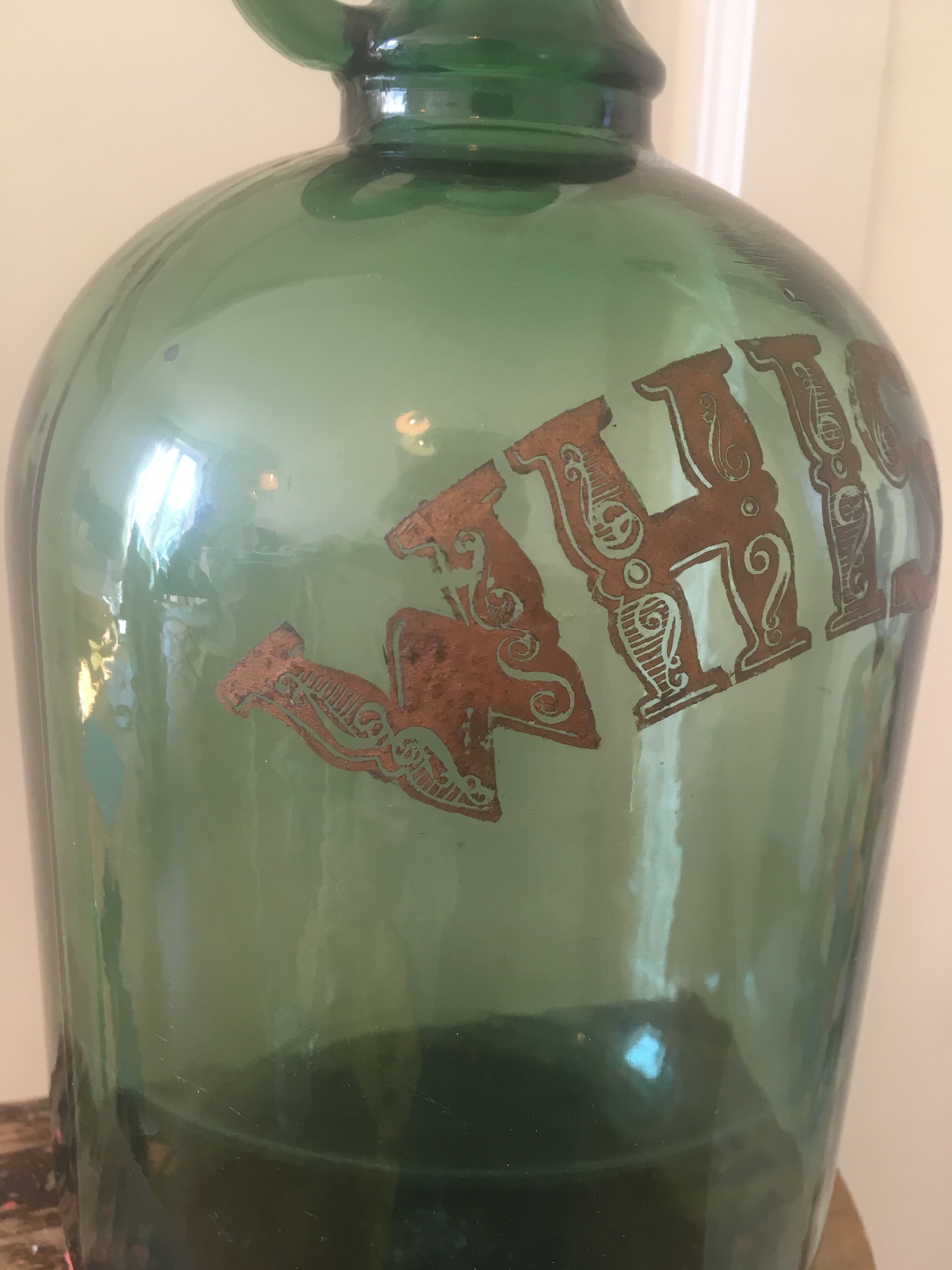 Green glass whiskey bottle