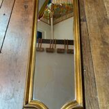 Large long mirror in gilded wood