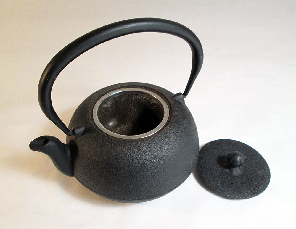 Black cast iron teapot