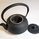 Black cast iron teapot