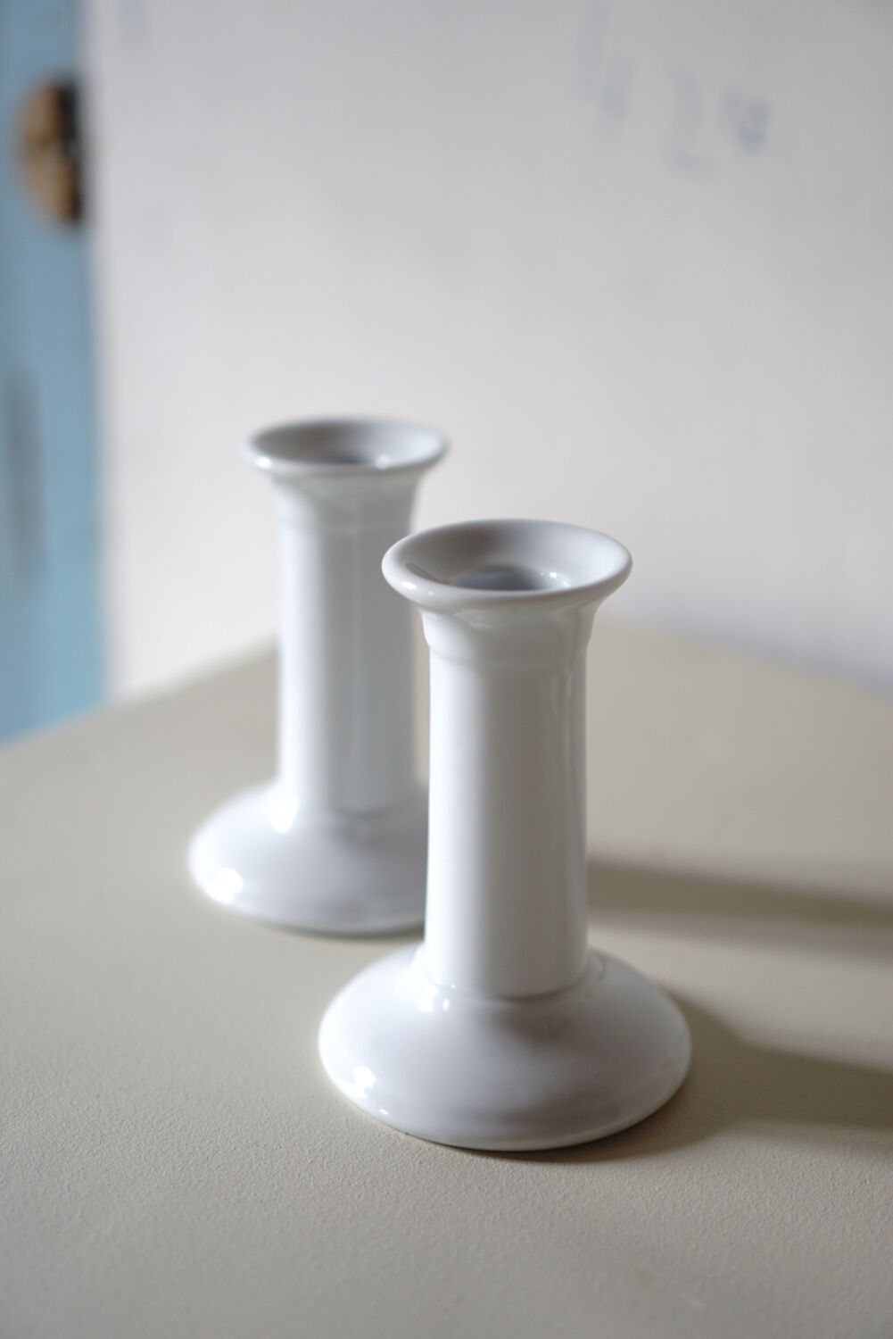 Porcelain candlestick duo