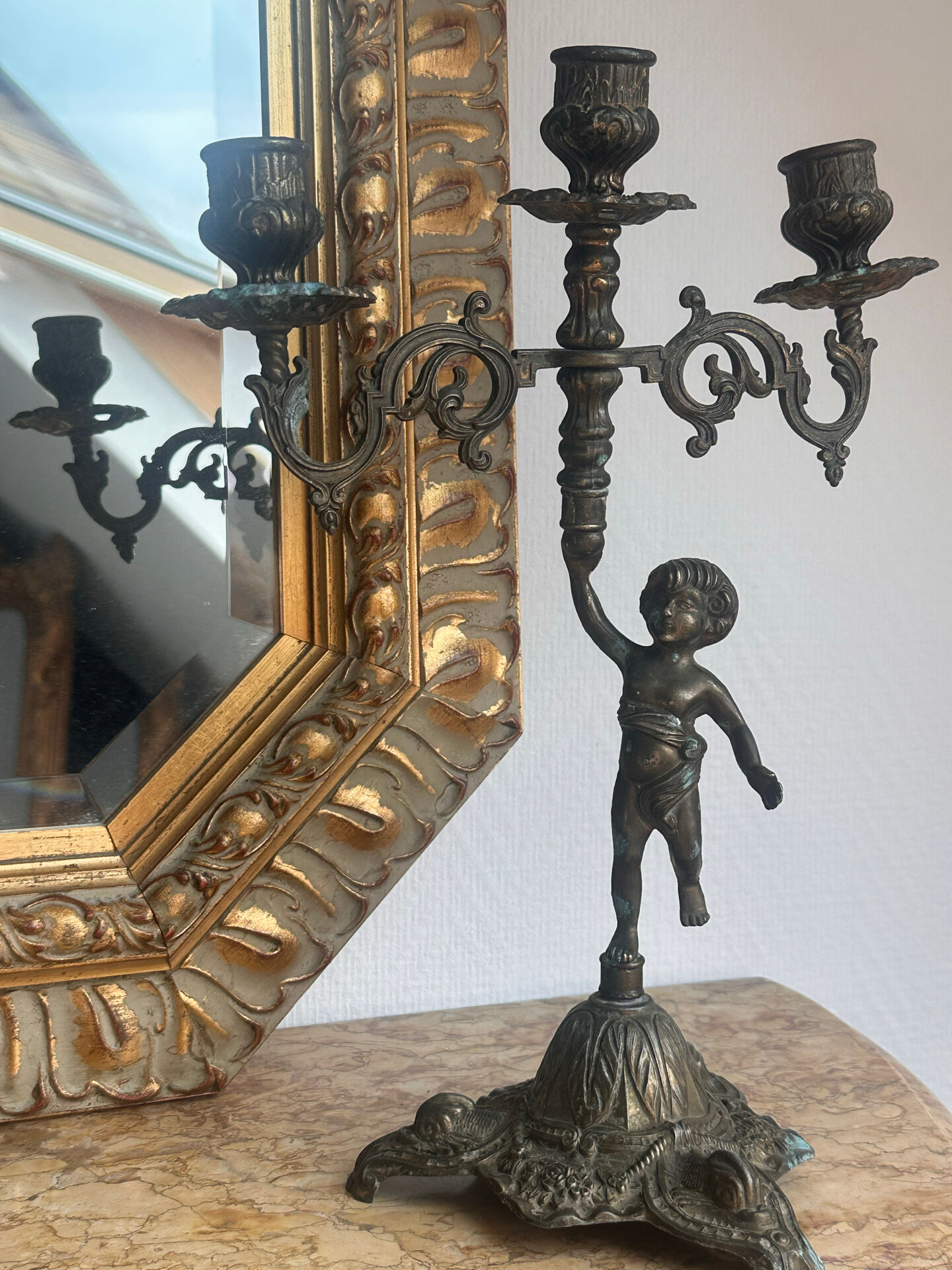 Set of 3 antique three-branch candelabras with cherubs and bronze patina.