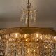 Old brass chandelier and crystal grapevines