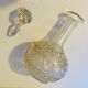 19th-century liqueur carafe in glass adorned with relief patterns.