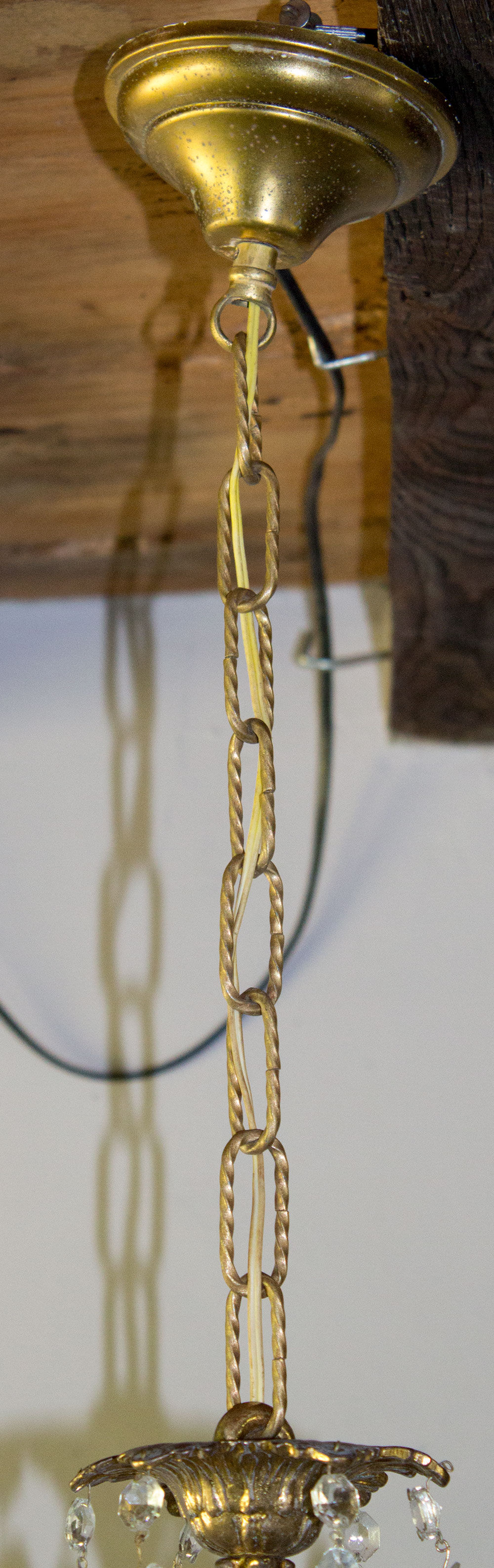 Old brass chandelier with glass stamps