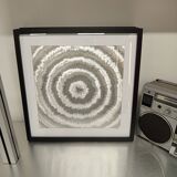 a Kinetic Op Art Aluchromy under glass frame.