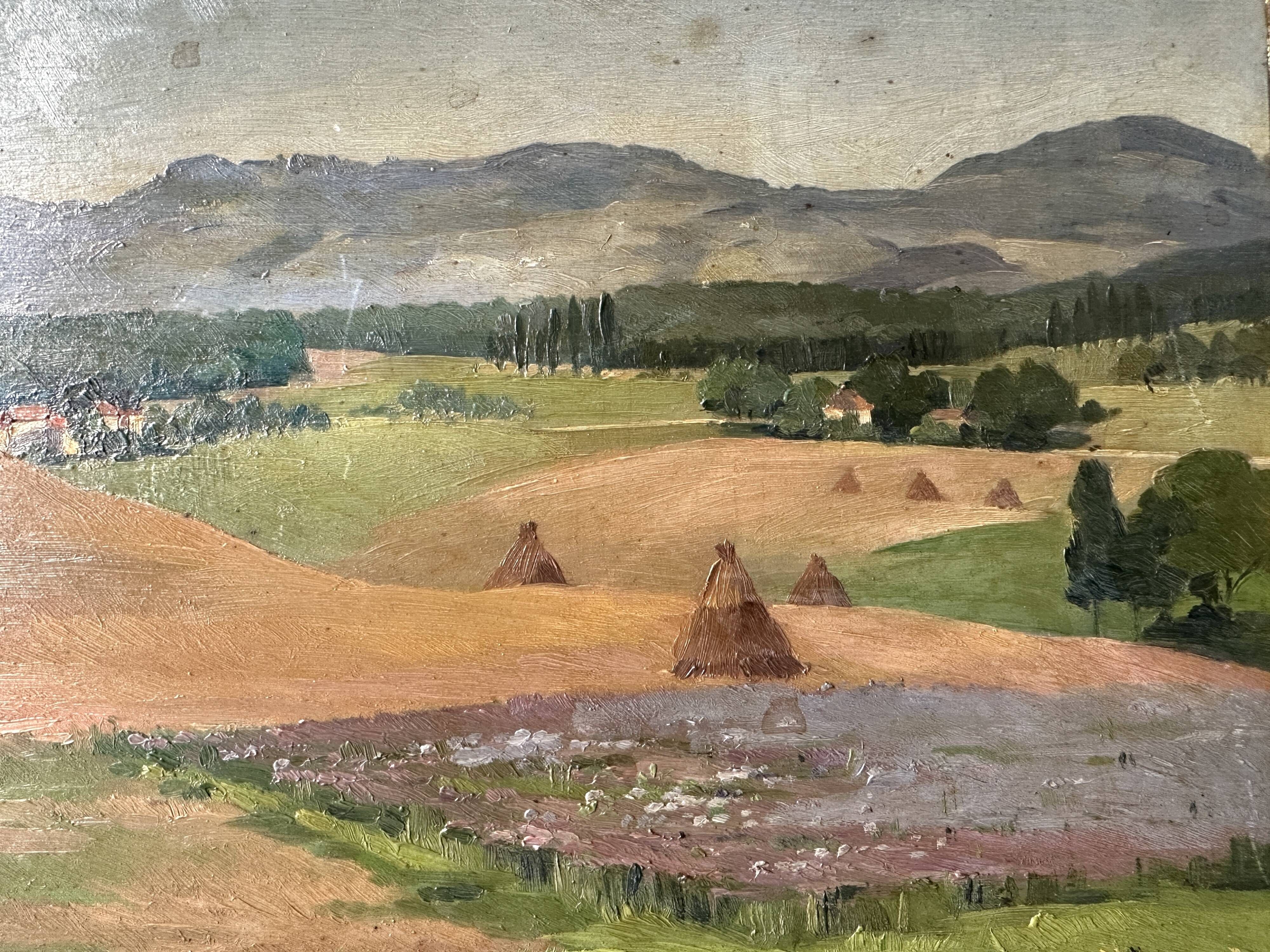 Old oil painting of a landscape on panel from 1920, haystacks.