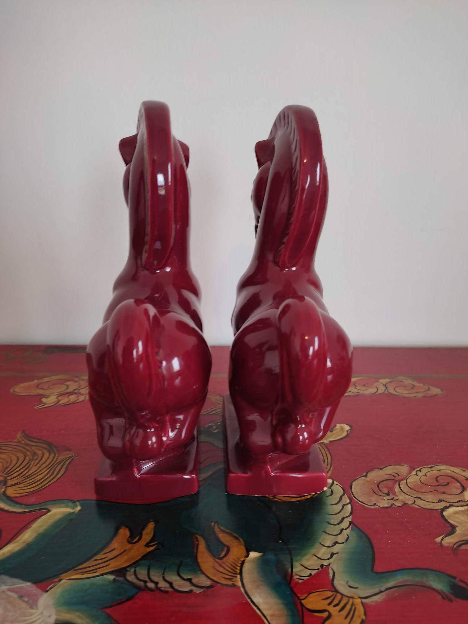 Pair of red porcelain horse bookends